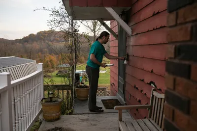 Alex Spragens canvasses door to door talking to voters before the election in Buchtel, OH on November 6, 2023.